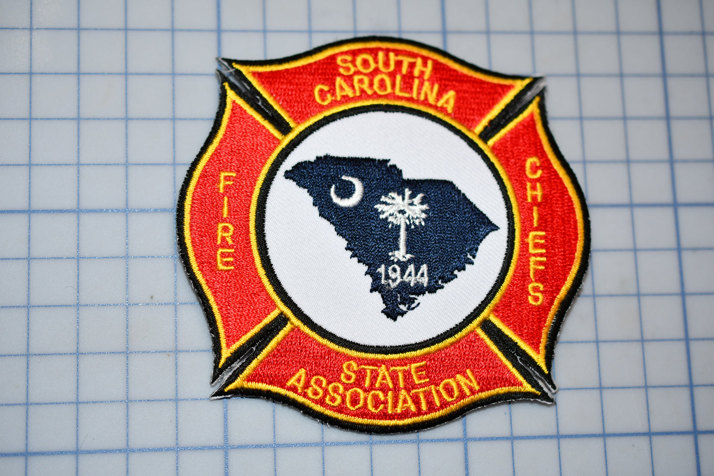 a fire department patch with a map of the state of south carolina