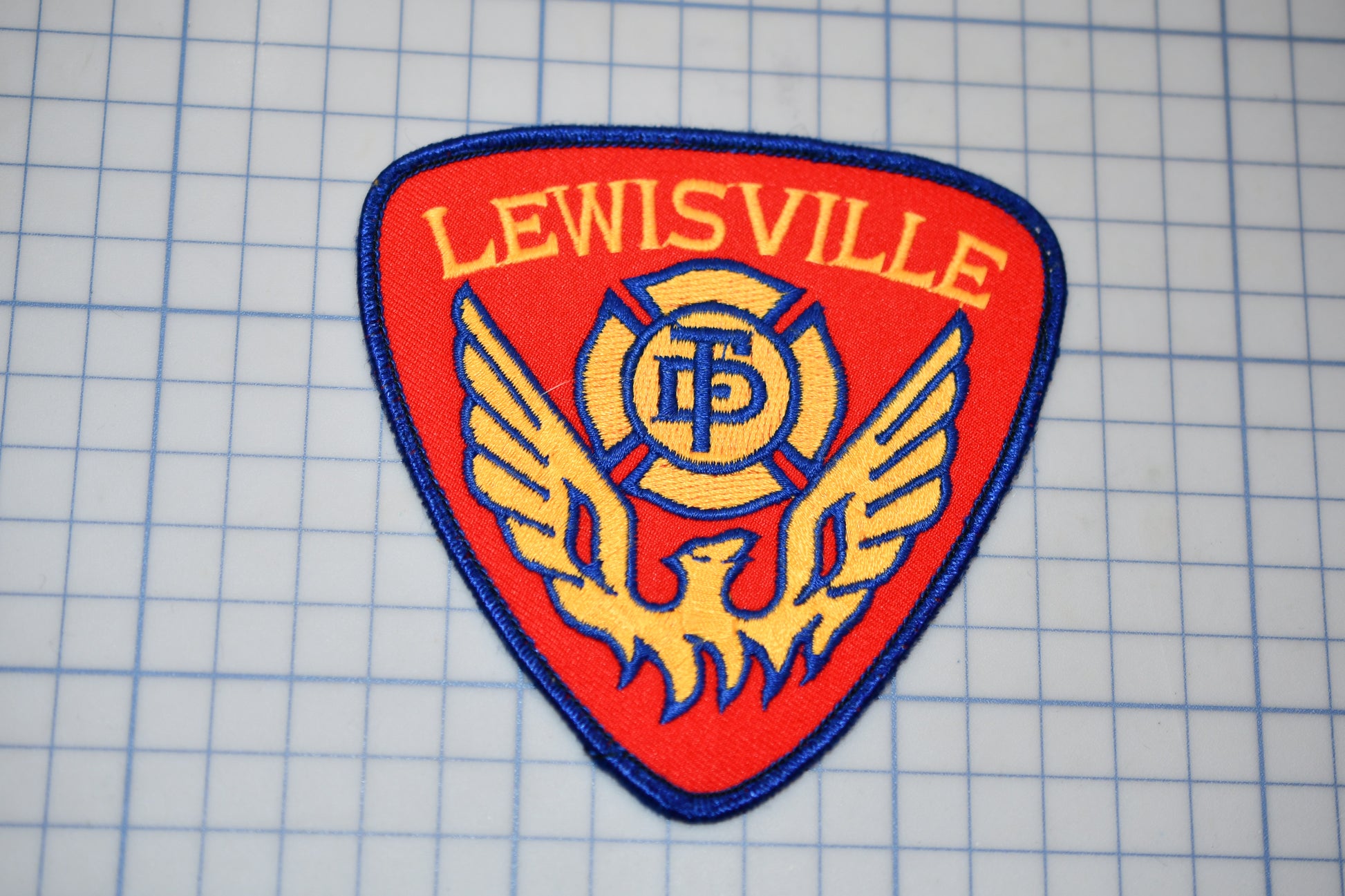 a patch with the words lewisville on it