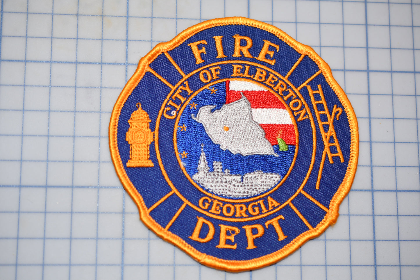 a fire department patch on a cutting board