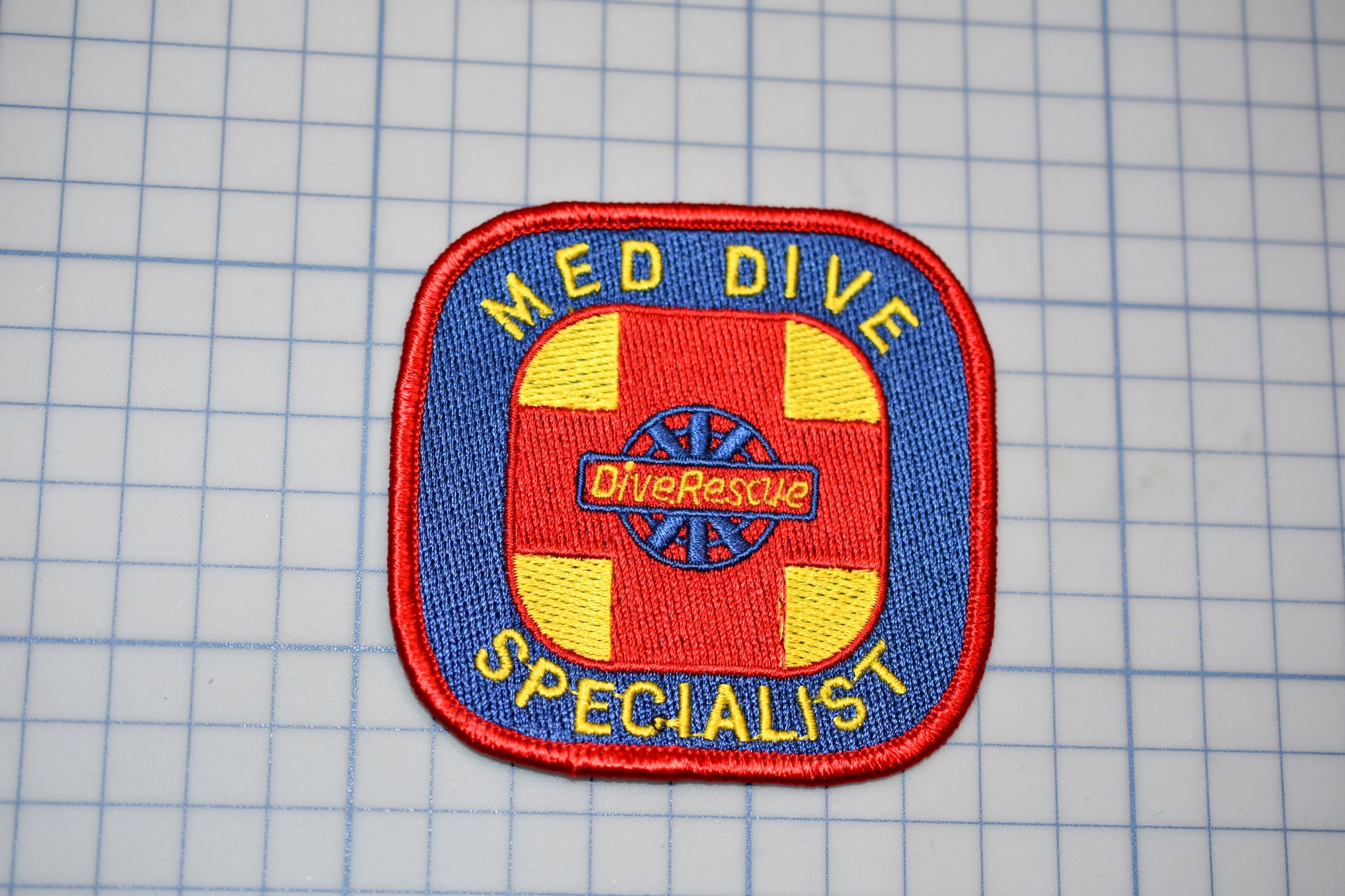 a patch that says med dive specialist on it