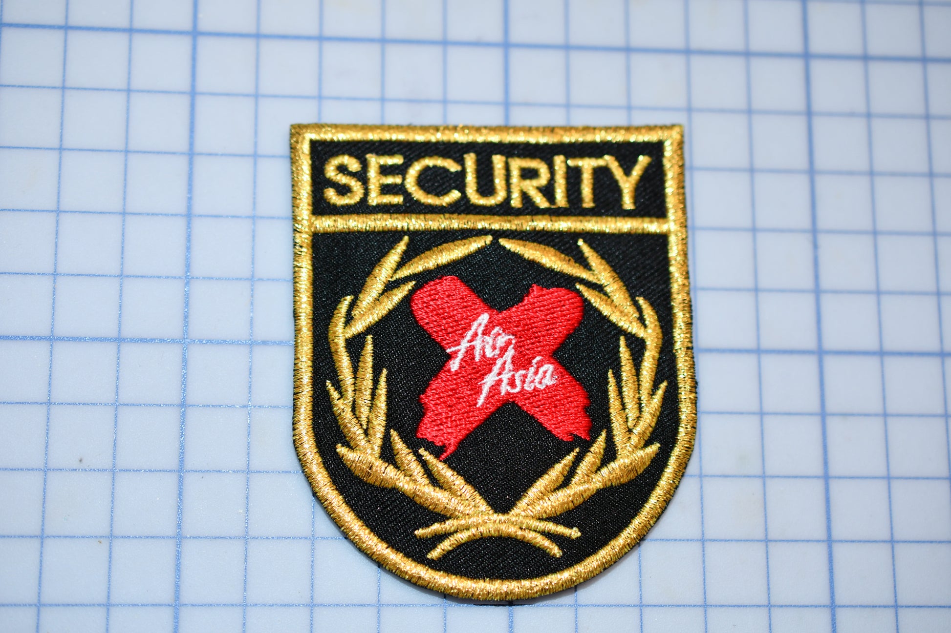 a security badge on a piece of paper