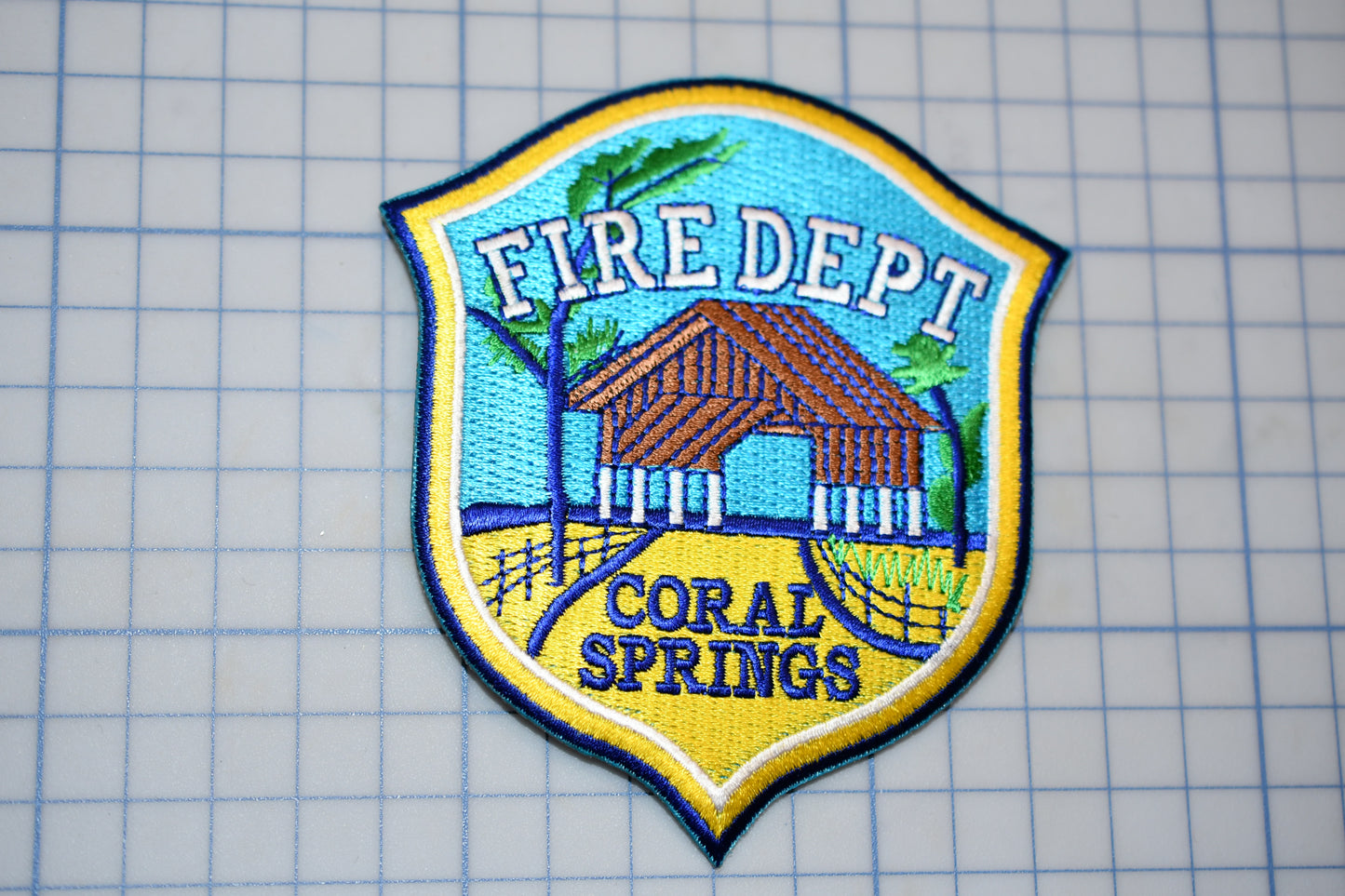 a fire department patch on a piece of paper