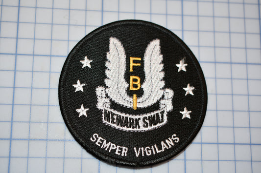 a patch with the words semper vigilans on it