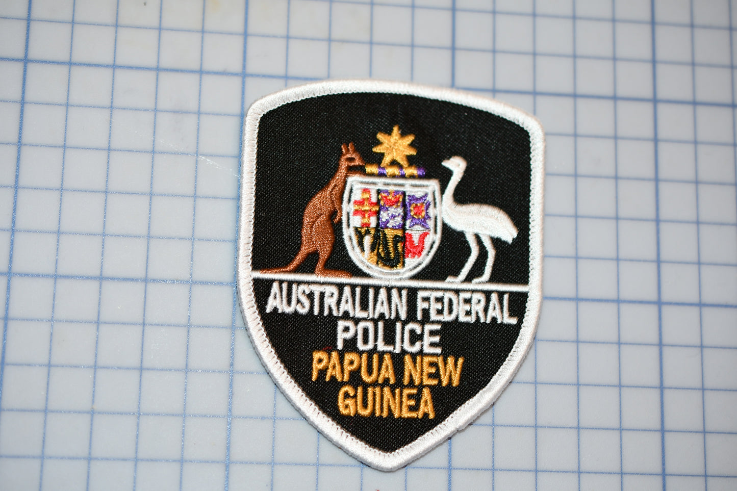 a patch with a picture of a kangaroo and the words australian federal police on it