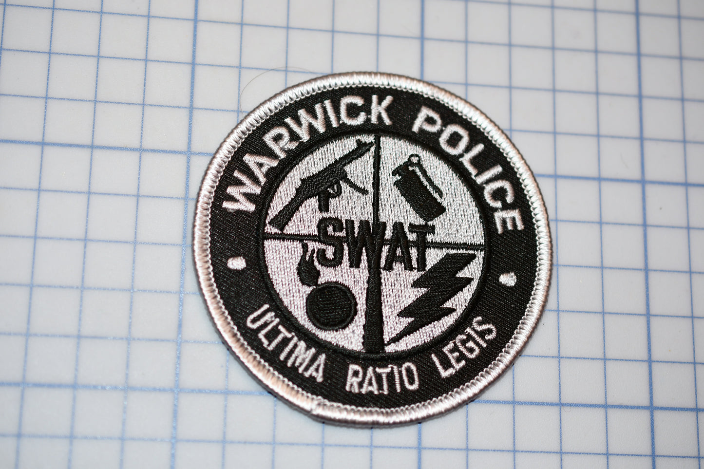 a patch with the words warrick police on it