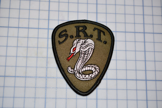 a patch with a picture of a snake on it