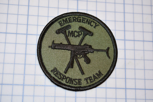 a patch with an image of a gun on it