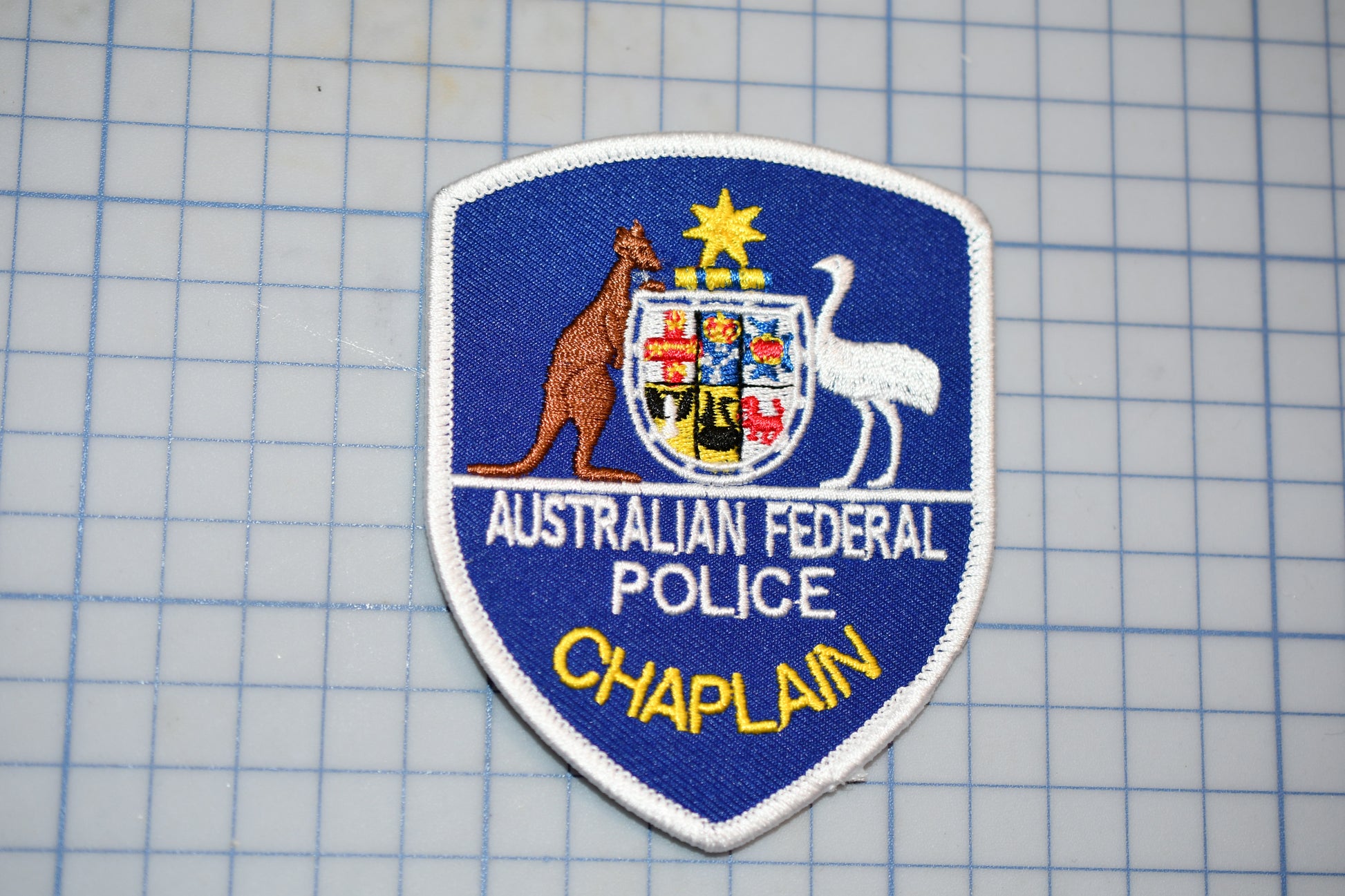 a patch with a picture of a kangaroo and the words australian federal police chaplain