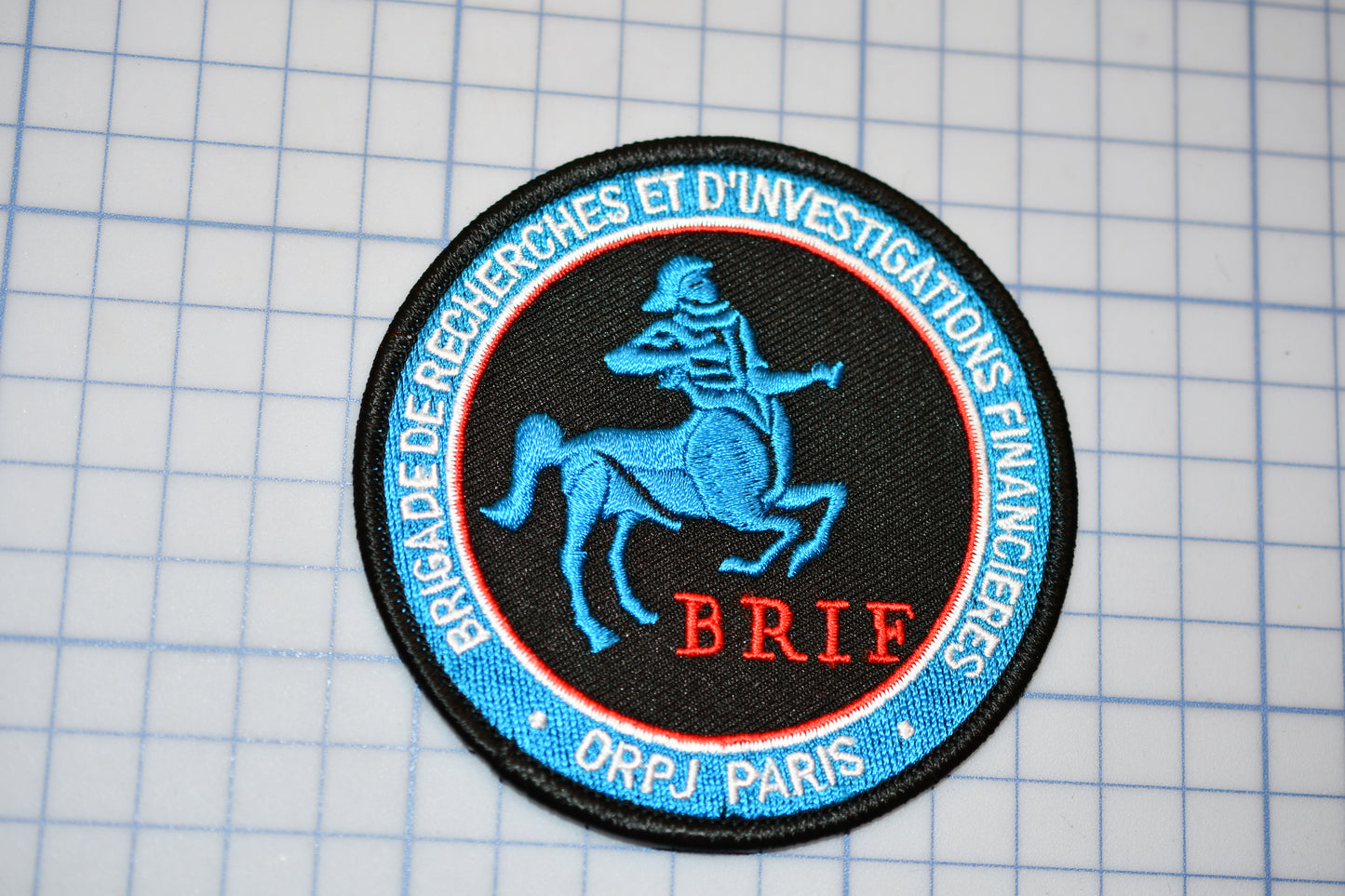 a patch with a skeleton riding a horse