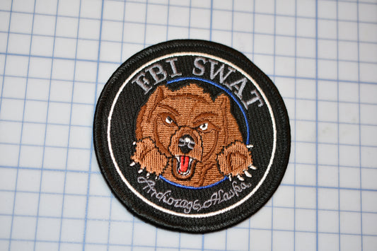 a patch with a picture of a bear on it