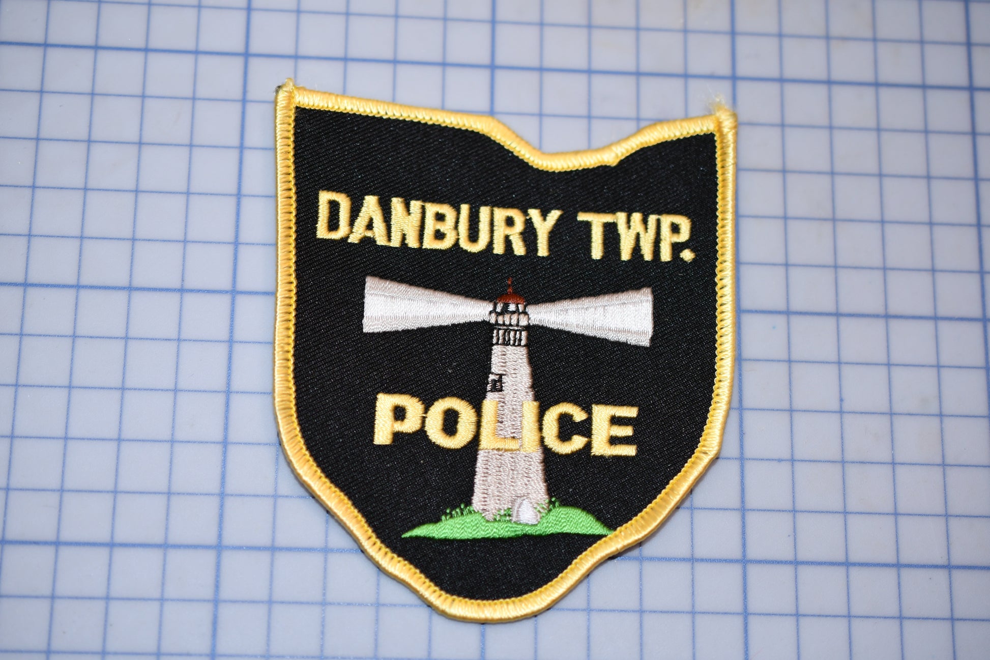 a badge with the words danbury twp police on it