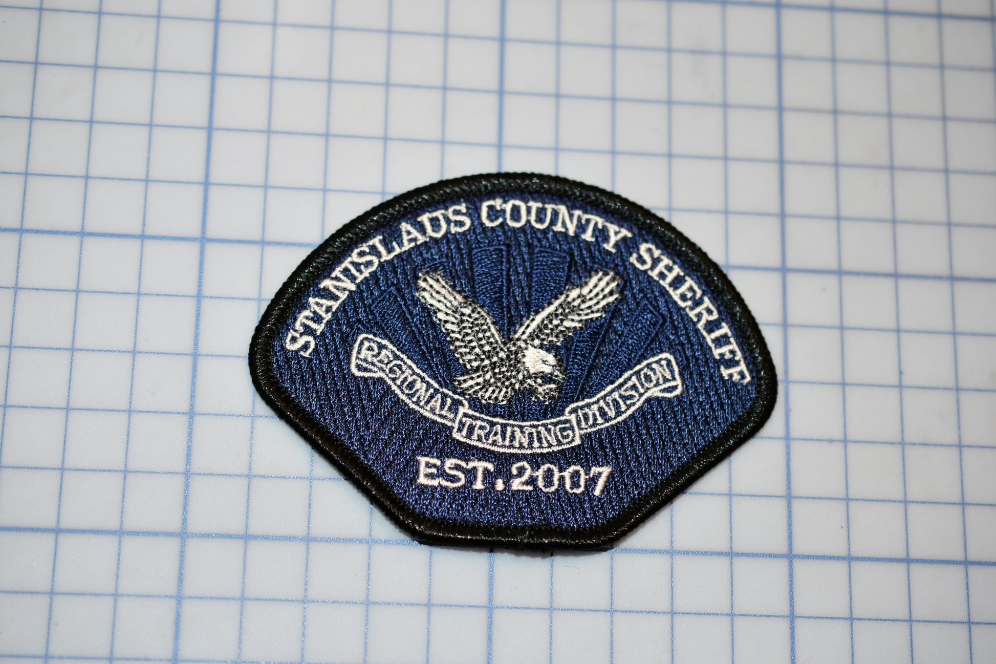 a patch with a picture of an eagle on it