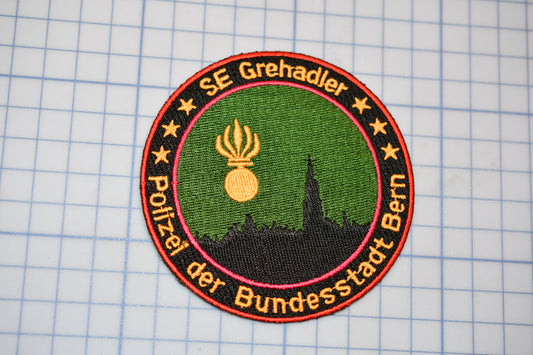 a patch with a picture of a building on it