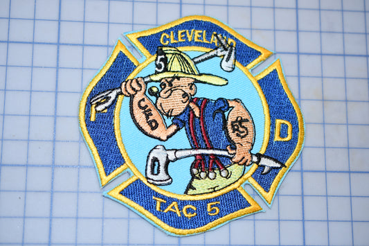 a patch with a fireman holding a wrench