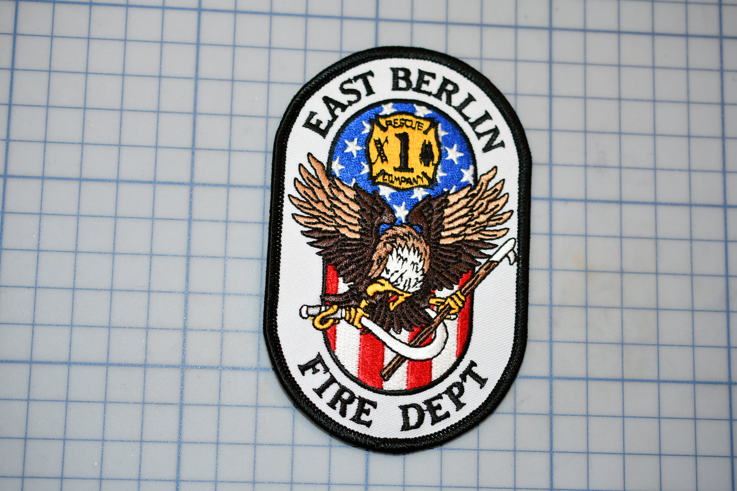 a patch with an eagle and the words east berlin fire department