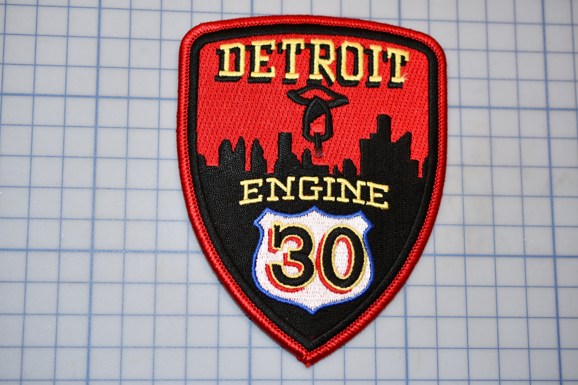 a detroit engine patch on a cutting board