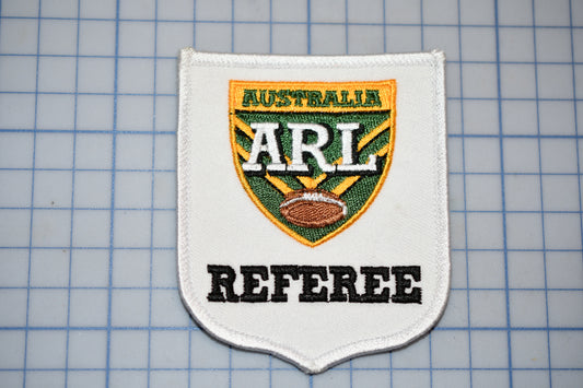 a patch with the words australia arl and a football on it