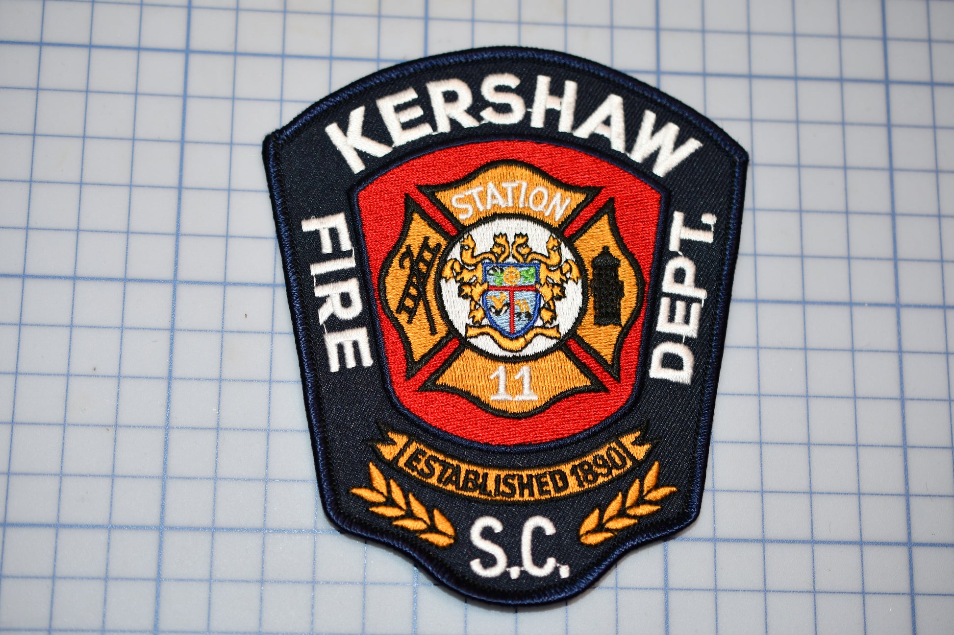 a fire department patch on a piece of paper