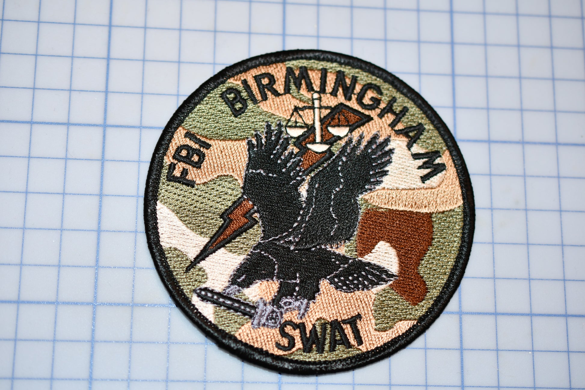 a patch with a picture of a bird on it