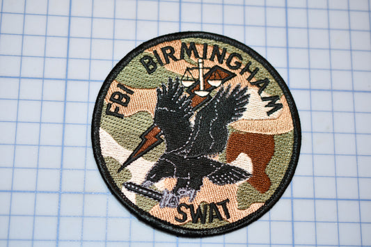 a patch with a picture of a bird on it