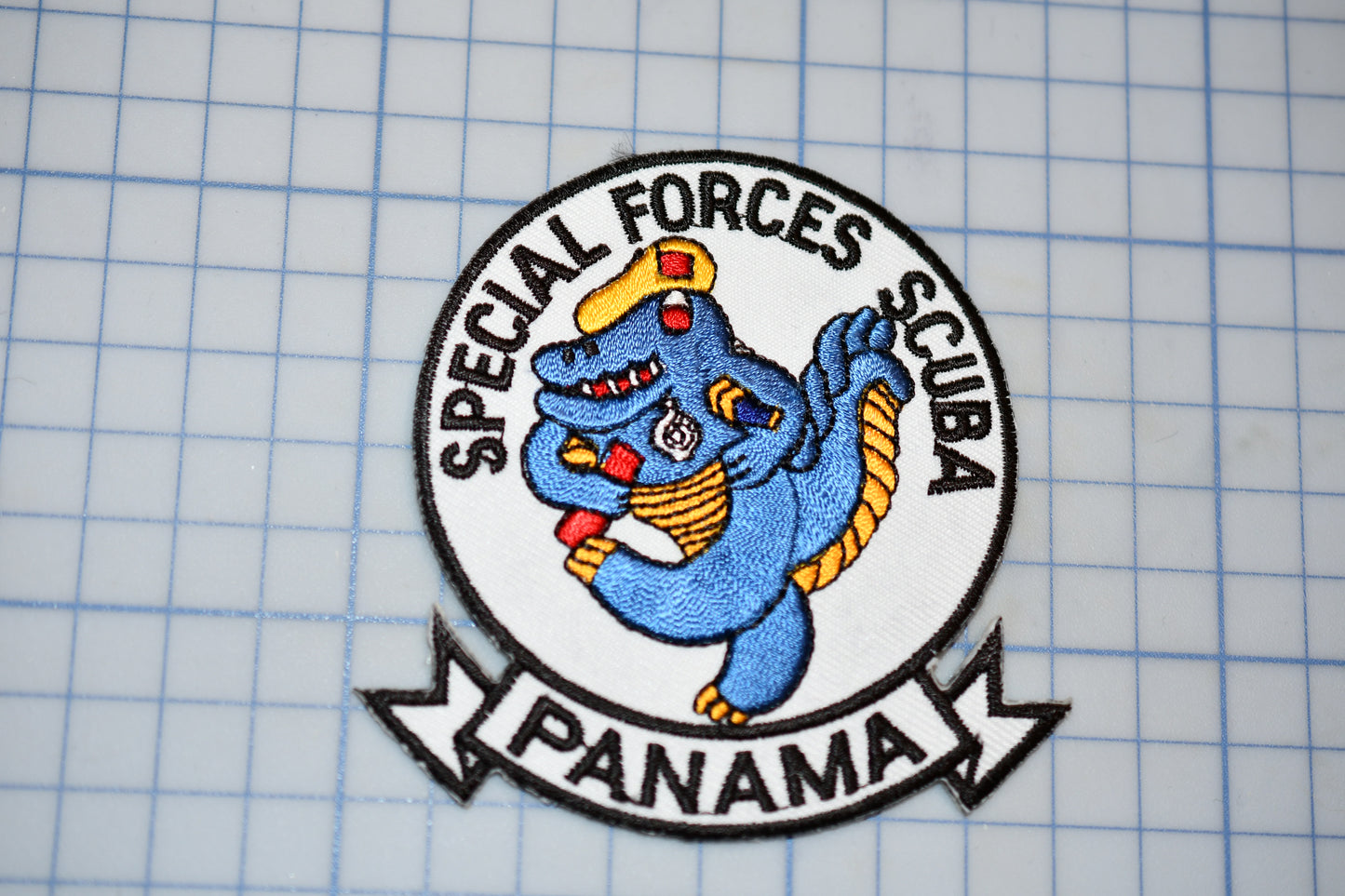 a blue sticker with the words special forces club on it