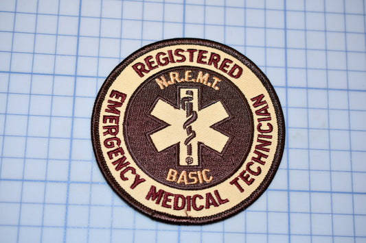 a patch with a medical symbol on it