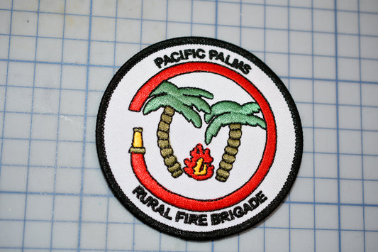 a patch with a picture of a palm tree and a fire hydrant