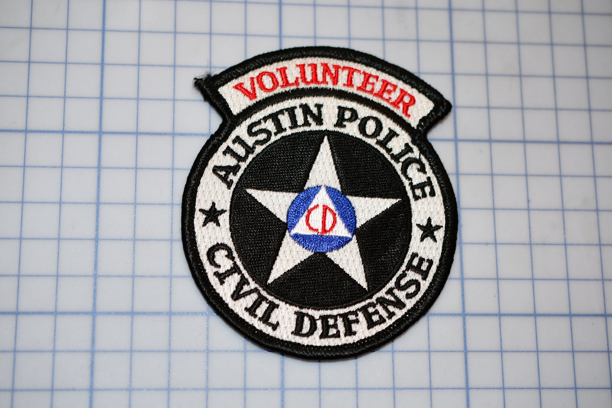 a patch with the words volunteer and a star on it