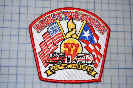 a patch with a fire truck and american flags on it