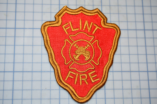 a fire department patch on a cutting board