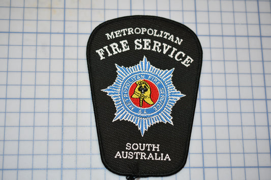 a fire service patch sitting on top of a table