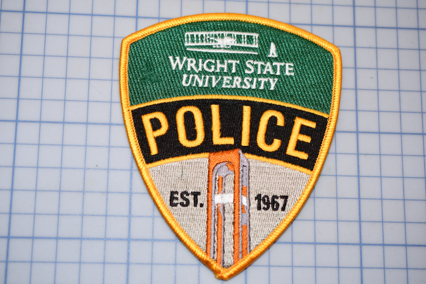 a patch of a police badge on a cutting board