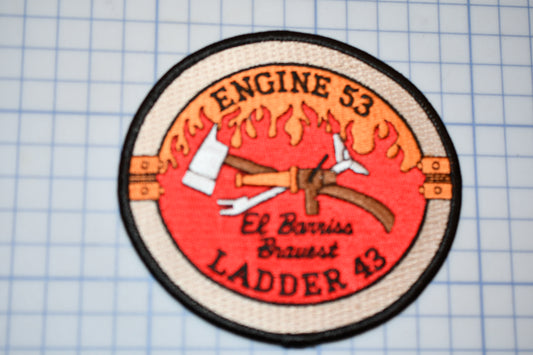 a patch with an image of a hammer and fire on it