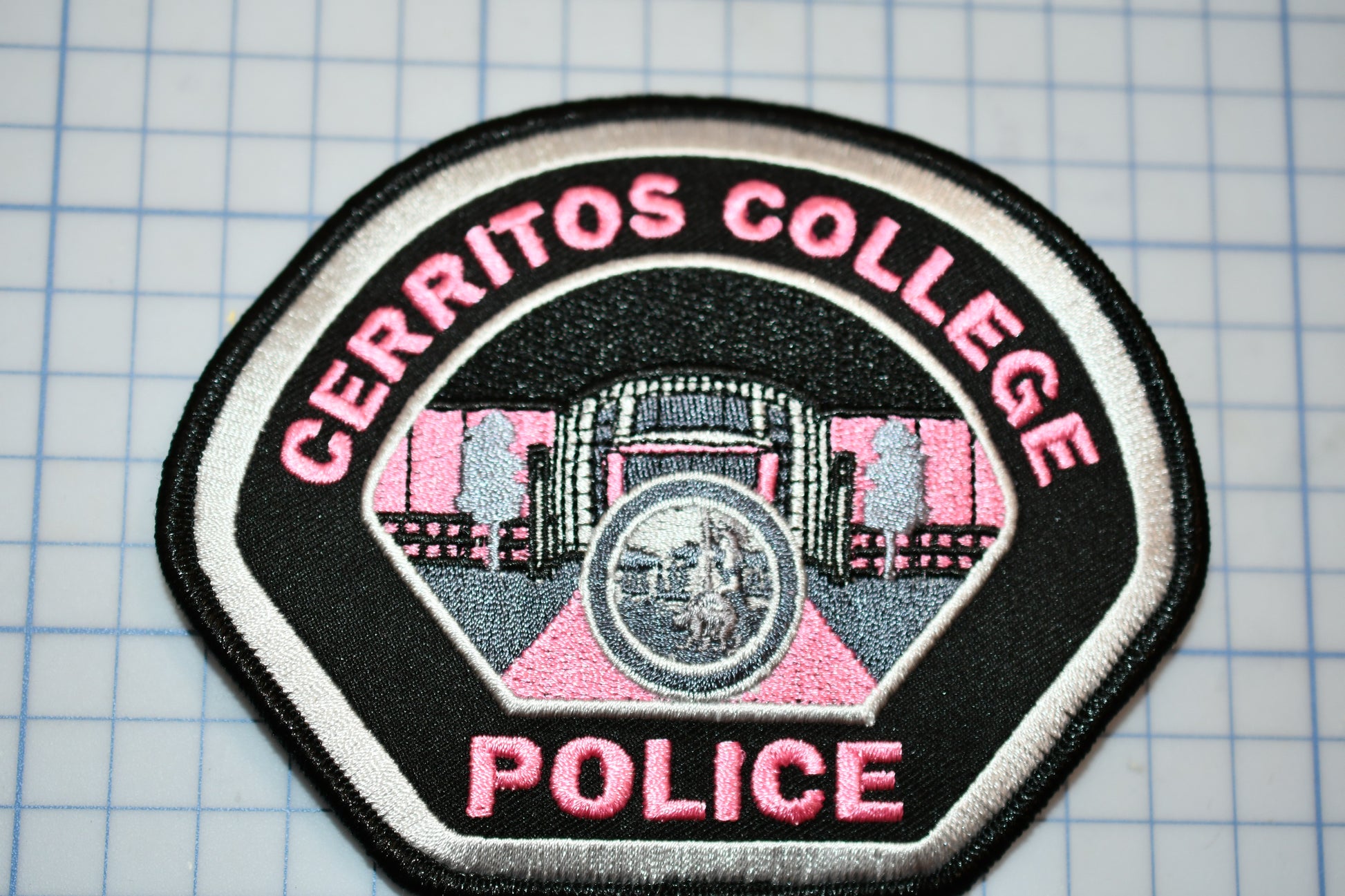 a police patch with the words cearros college on it