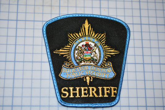 a patch of a sheriff badge on a cutting board