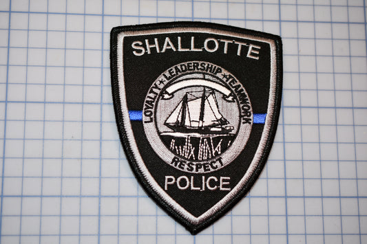 a police patch with a boat on it