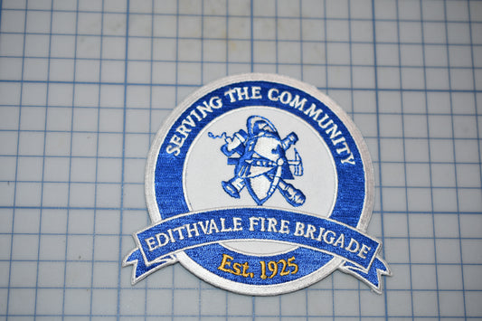 a blue and white patch with the words serving the community