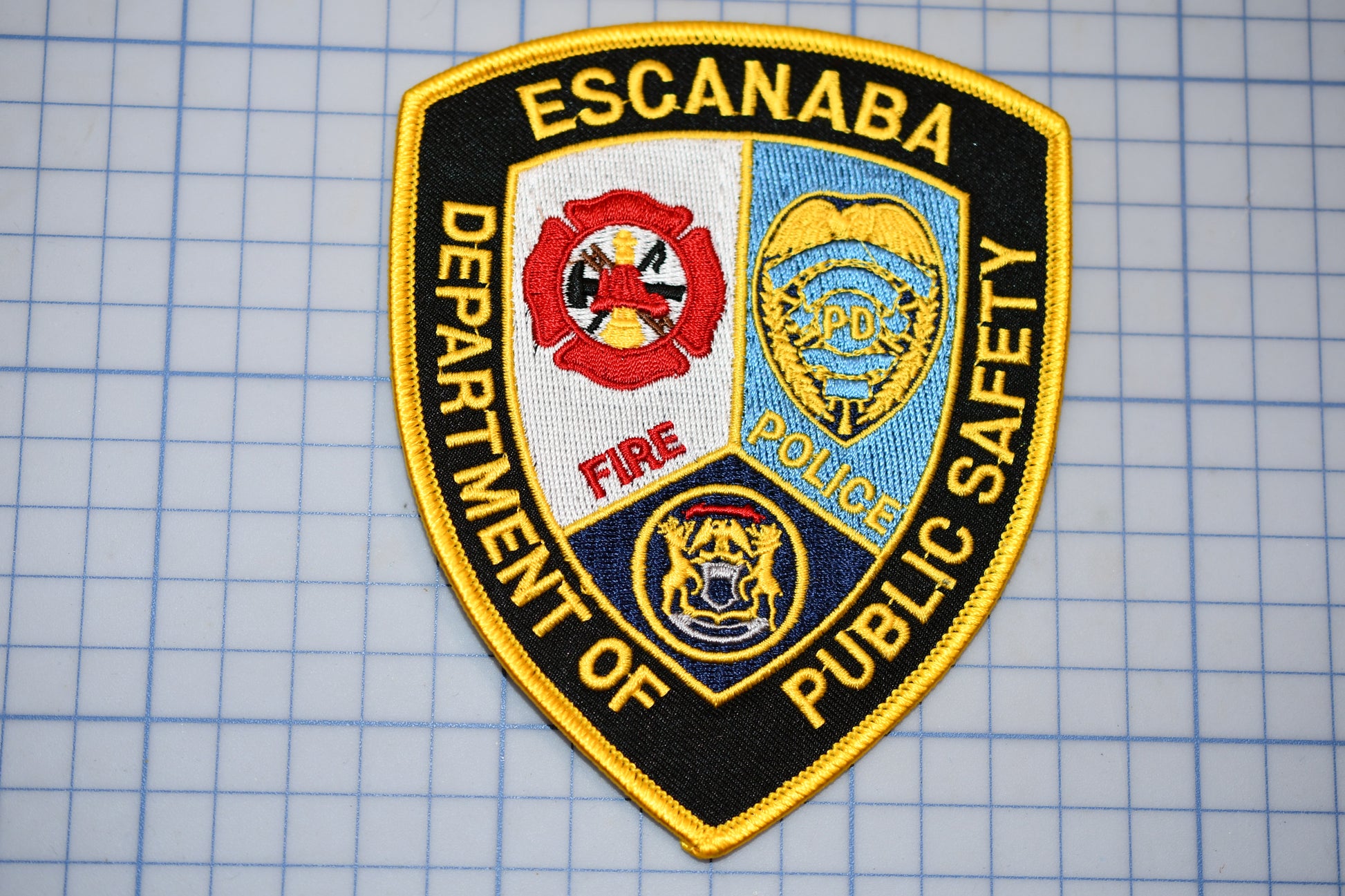 a police patch on a piece of paper