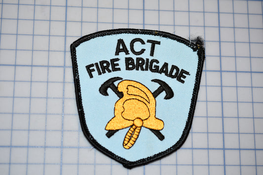 a patch that says act fire brigade on it