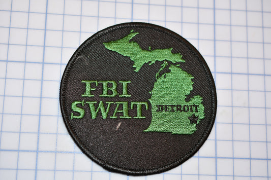 a patch with a map of the state of michigan