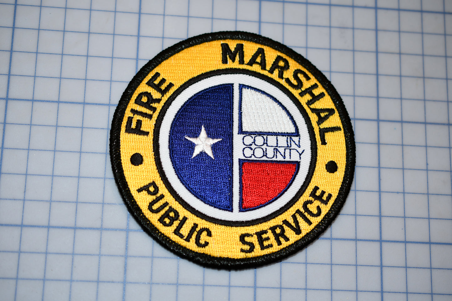 a patch with the words free marshall public service on it