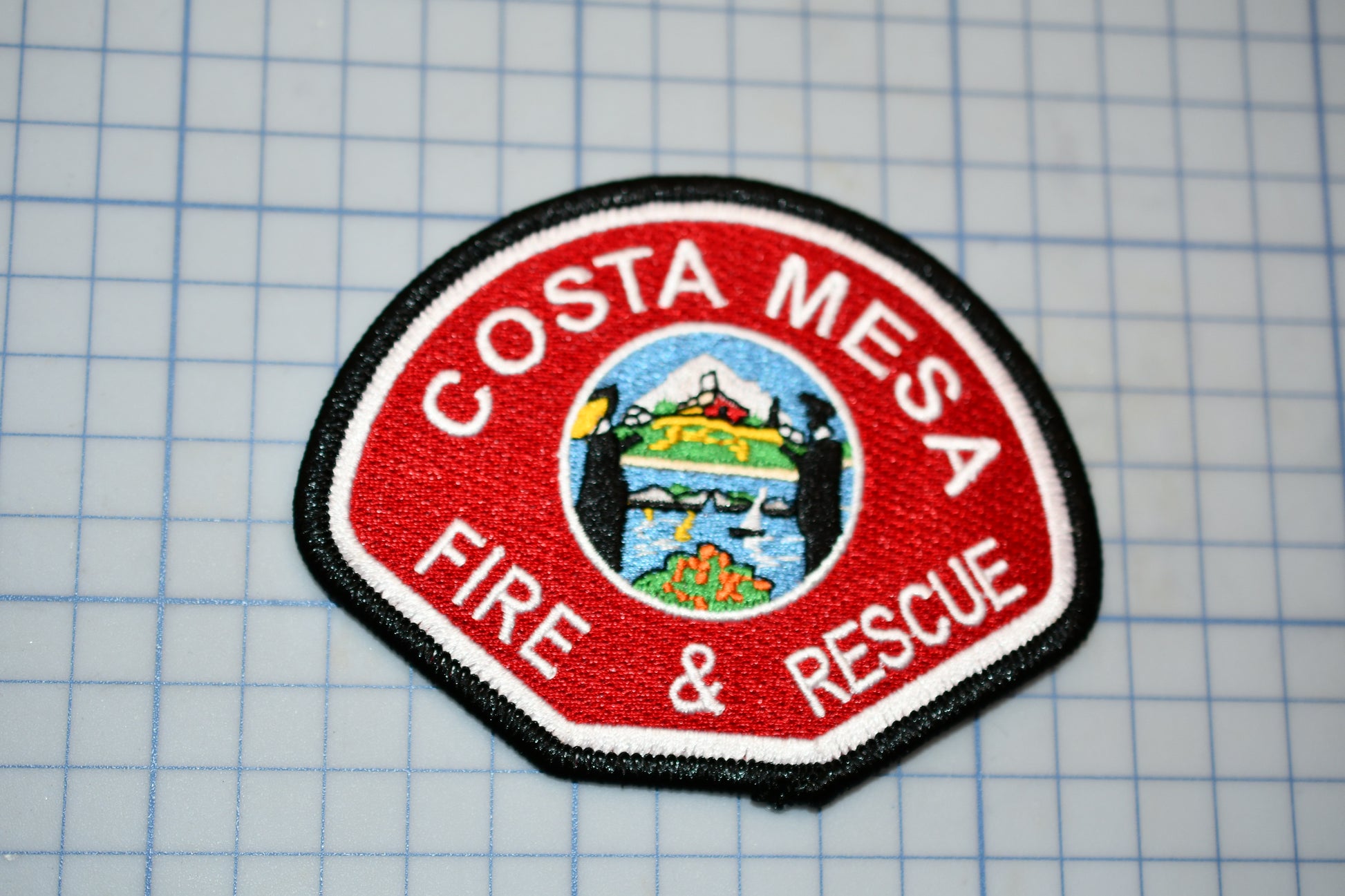 a patch with a fire and rescue logo on it