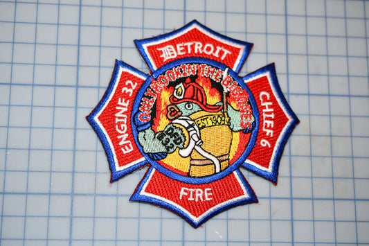 a fire department patch on a cutting board