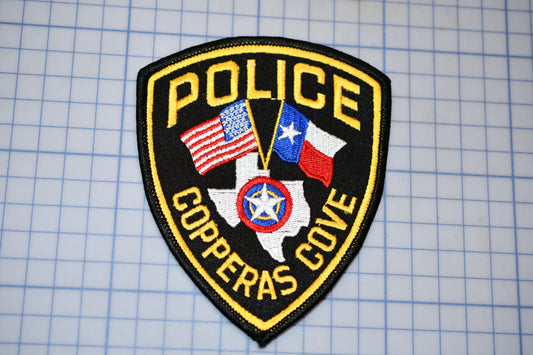 a police badge on a piece of paper