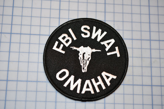 a patch with the words fbj swat on it