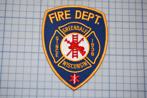 a fire department patch with a ladder on it