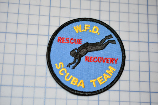 a patch with a scuba team logo on it