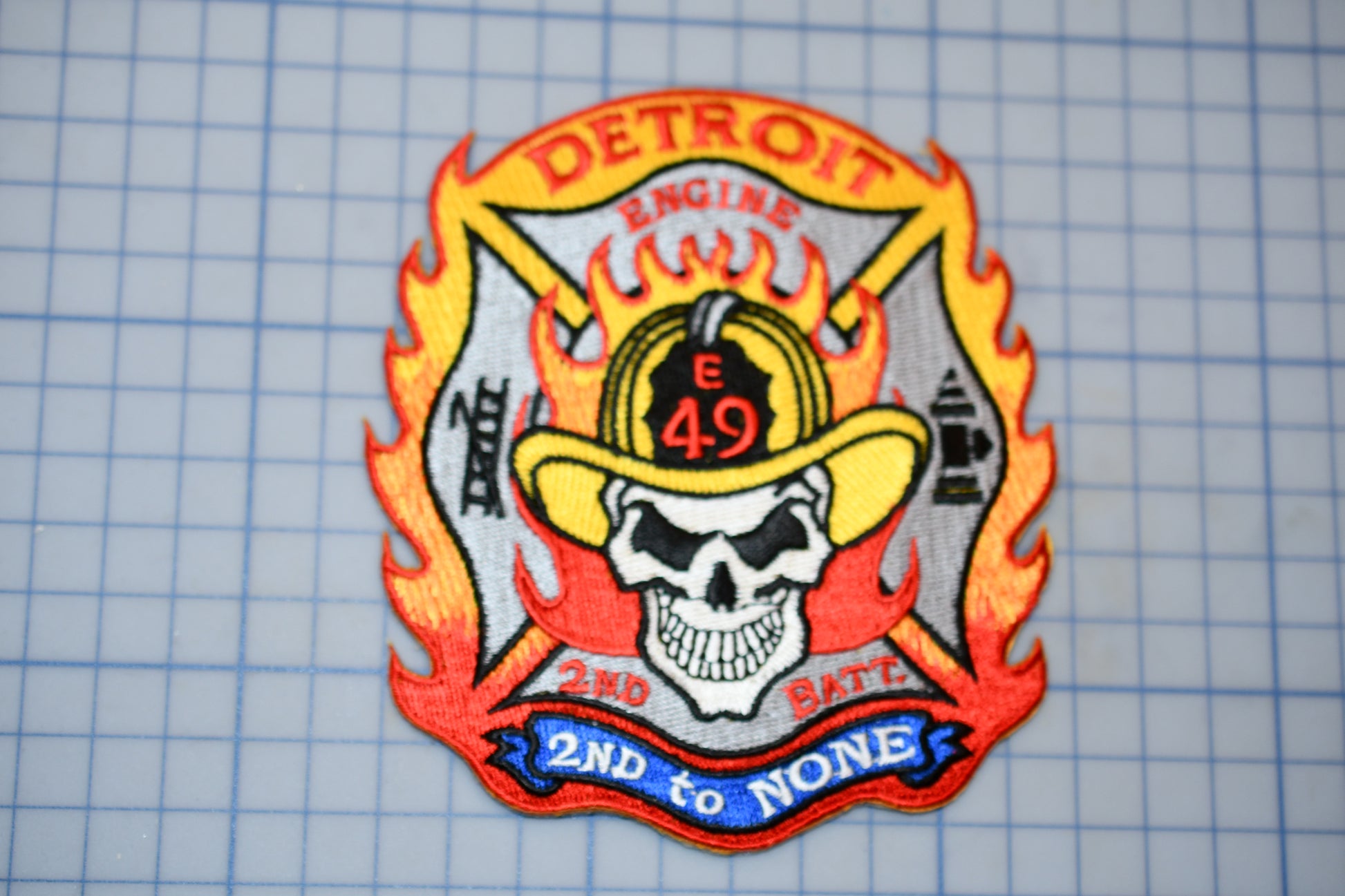 a patch with a fireman's hat on it