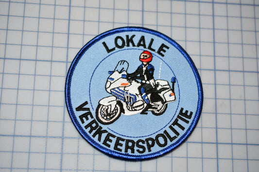 a patch with a picture of a person on a motorcycle