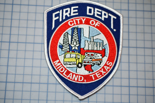 a fire department patch on a piece of paper